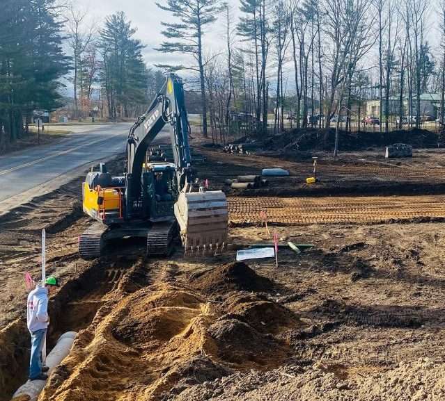 Excavator Grading Dirt